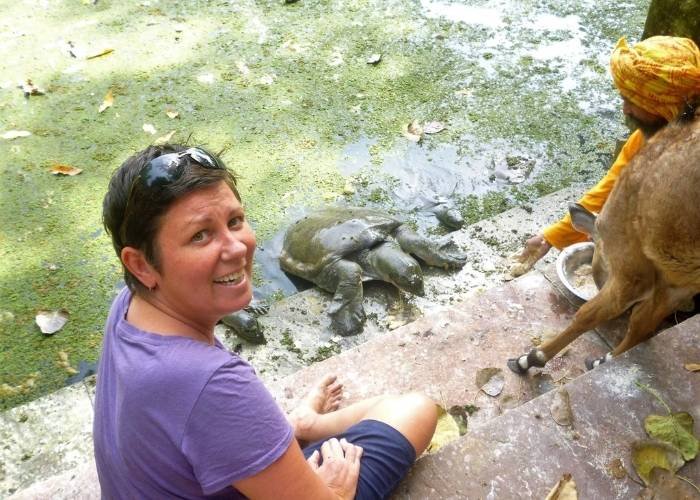 Solo Female Travel Podcast 5 Solo female traveler feeding turtle in India